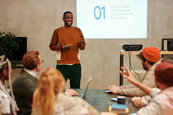 Diverse group of people smiling during a wellness workshop.